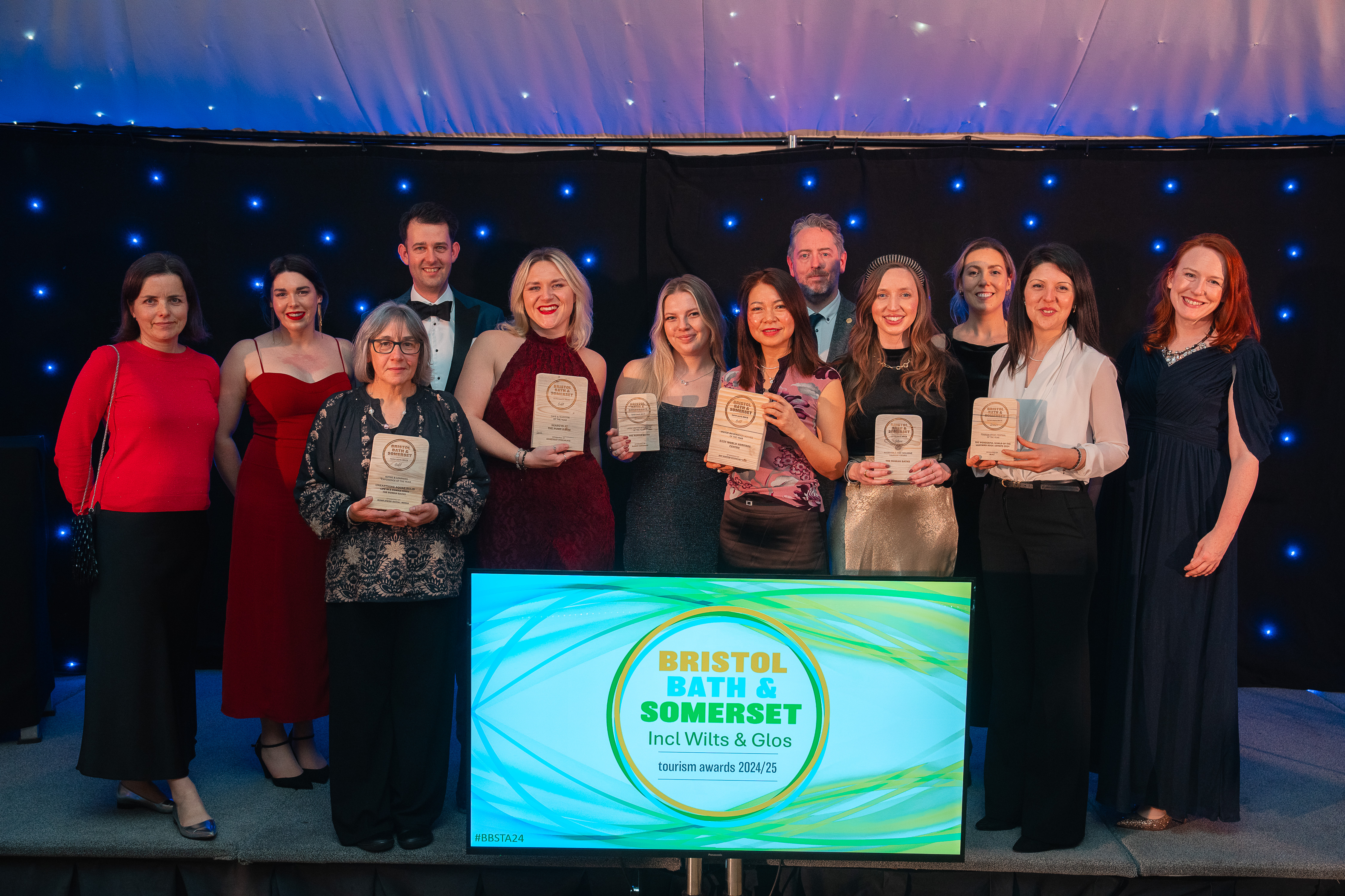 Members of staff from Bath Heritage Services collect awards